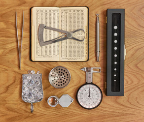 Collection of Jewellery Tools for Diamond Grading with Antique Book and Loose Diamonds