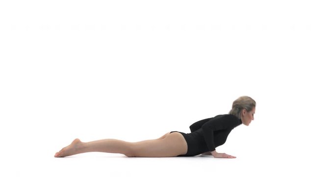 Professional female athlete performing cat yoga pose. Isolated, on white background
