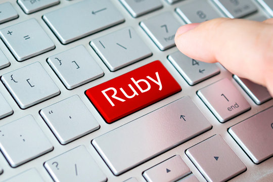 button with the ruby on grey keyboard of a modern laptop.