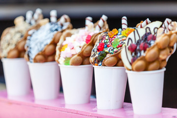 vanilla ice cream bubble waffle with fruit and sweets