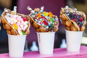 vanilla ice cream bubble waffle with fruit and sweets