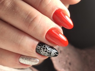 stylish manicure with a design on beautiful hands