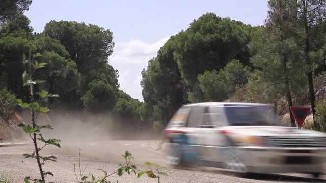 Classic race car in a empty road running fast (High Speed)