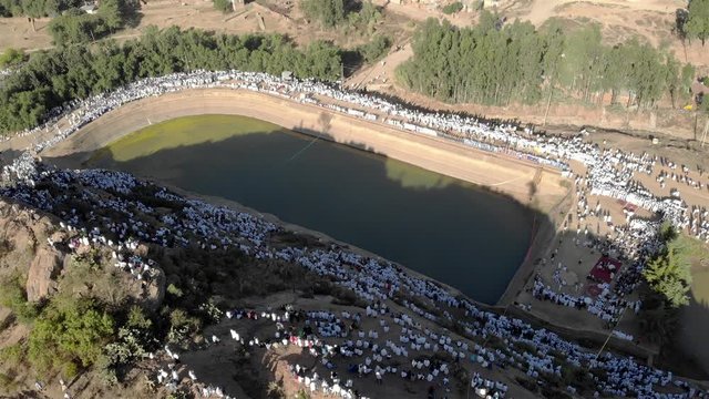 Drone view over Ethiopian Timkat Ceremony Gathering at reservoir for baptism , Axum, Ethiopia,19.1.2020
