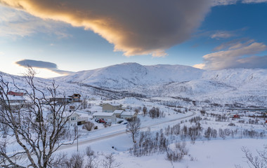 Fototapeta na wymiar winterlandscape with dramatic sky on Kvaloeya Island near Tromsoe in northern Norway, landscape photography