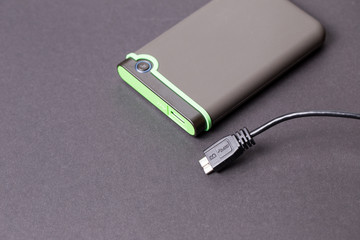 Hard disk on a black isolated background close-up.