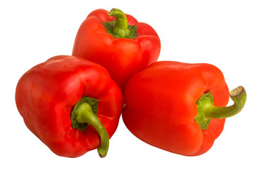 three red bell peppers on a white background