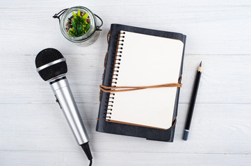 Microphone and empty open note book