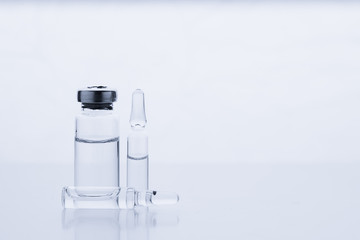 Ampoules for injection. Glass medical vials for vaccination. Transparent bottles and disposable...
