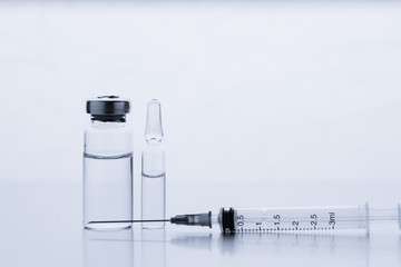 Ampoules for injection. Glass medical vials for vaccination. Transparent bottles and disposable...