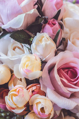 Close up of artificial flowers; floral background