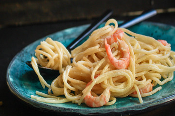pasta prawn (spaghetti shrimp cream sauce and seafood ) menu concept. food background. top view. copy space