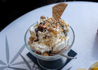 Italian ice cream with nuts and biscuit at outdoor