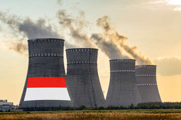 Nuclear plant chimneys displaying flag of Indonesia with according text. Energy pollution accidents...