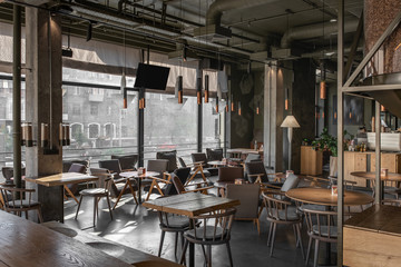 Fototapeta na wymiar Interior of modern cafe in loft style