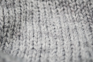 Closeup of grey woolen pullover texture