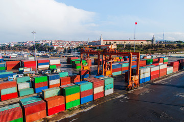 General view from a port with stacked containers and cranes