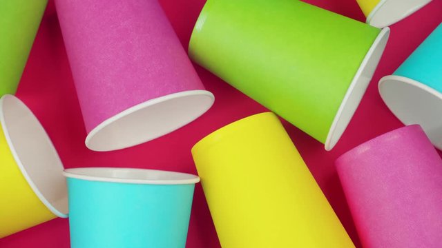 Flat lay multicolored paper cups. background Red color