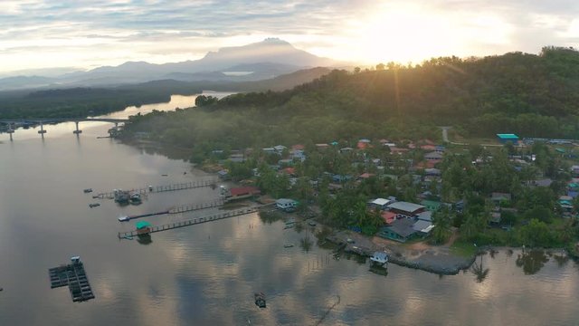 Aerial 4K footage of beautiful sunrise landscape scenery at Mengkabong River Tuaran, Sabah, Malaysia 
