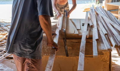 Technicians working together using outdated machinery