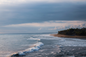 waves on the beach at balian beach bali