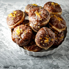Fresh donuts on dark mood background and copy space for your decoration.Fat Thursday time in Poland.