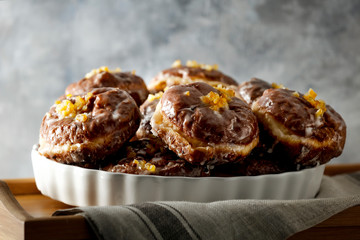 Fresh donuts on dark mood background and copy space for your decoration.Fat Thursday time in Poland.