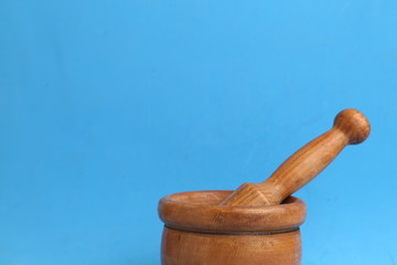 cooking wooden mortar in color background