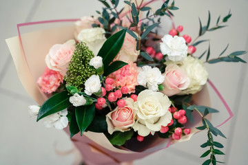 bouquet in soft pink tones with exotic berries