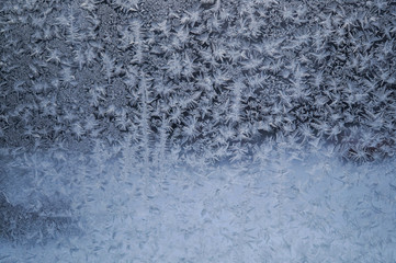 frost painted snowflakes on glass