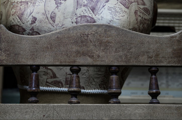 Fototapeta na wymiar retro testure on a chair with carved mounts