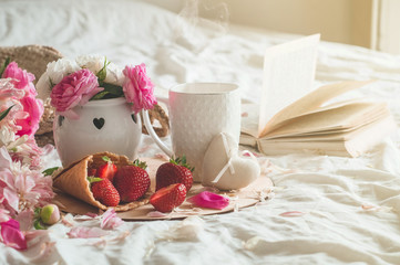 Still life details in home interior of living room. Cup and Book spring decor on the books. Read, Rest