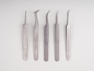 lots of eyelash tweezers, eyelash extension tools for women