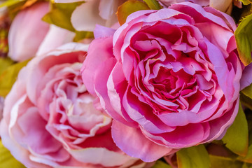 Artificial flowers. Pink Roses. Scenery. 