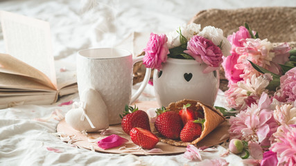 Still life details in home interior of living room. Cup and Book spring decor on the books. Read, Rest