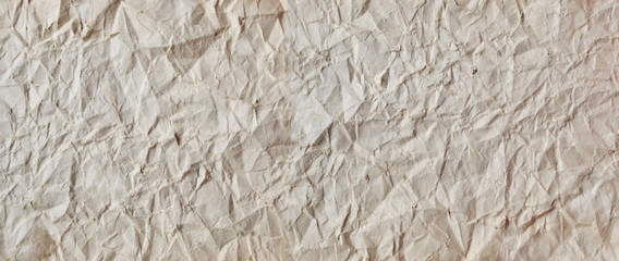 Creative background with scattered overlay of crumpled papers.