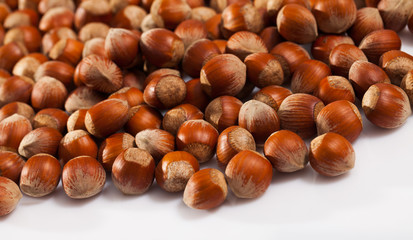 Fototapeta premium Hazelnuts on white surface