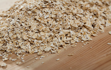 Cereals and healthy eating concept — oatmeal flakes. Natural background