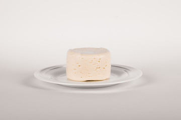 White ricotta cheese in a white platter