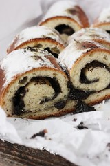 Delicious roll with poppy seeds on the table