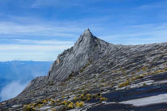 South Peak (3,921m) of Mount Kinabalu, Sabah, Malaysia.  Mount Kinabalu or Gunung Kinabalu is the 20th most prominent mountain in the world by topographic prominence.