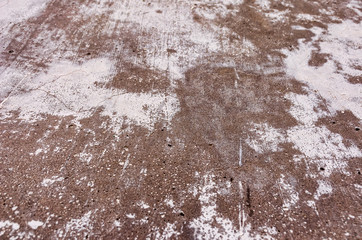 Old concrete wall with paint stains.