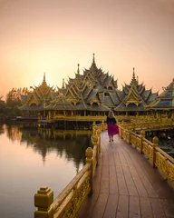 Selbstklebende Fototapeten Amazing sunset on temple in Thailand with tourist girl - Ancien Siam in Bangkok  © InProgressCreatives