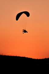 Silhouette of Paramotor at Sunset