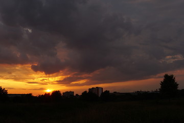 Fototapeta na wymiar Fiery orange sunset sky. Beautiful sky.