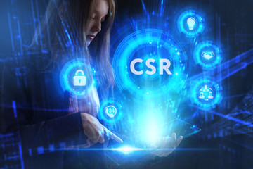 Business, Technology, Internet and network concept. Young businessman working on a virtual screen of the future and sees the inscription: CSR