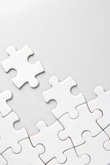 Fototapeta premium White jigsaw puzzle on white background