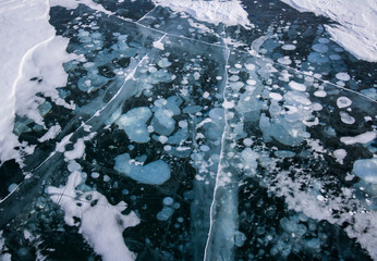 View of bubbles suspended in the ice on Abraham lake in Alberta, Canada.
