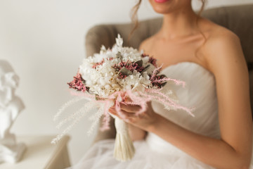 Wedding bouquet in hands of beautiful bride. Wedding concept.