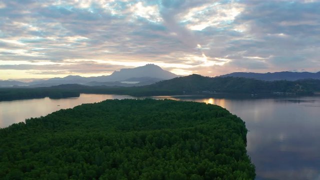 Aerial 4K footage of beautiful sunrise landscape scenery at Mengkabong River Tuaran, Sabah, Malaysia 